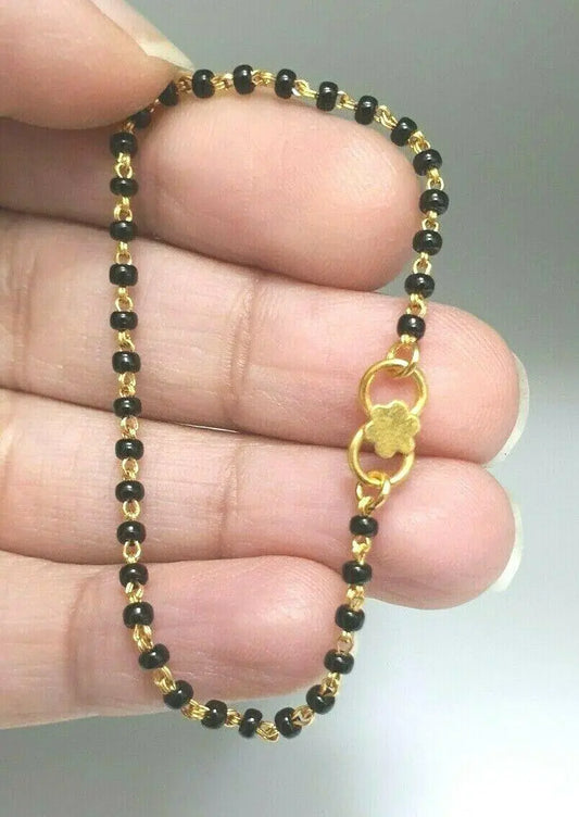 18ct Yellow Gold Baby Bracelet Black Beaded With Diamond Cut Design 