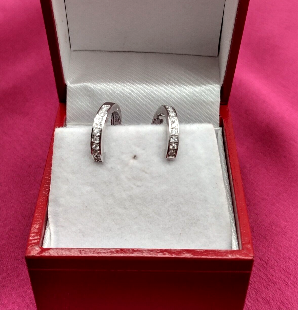 An Elegant Pair of Diamond Hoop Mini Earrings made in 14K White Gold, set with 0.19 carats