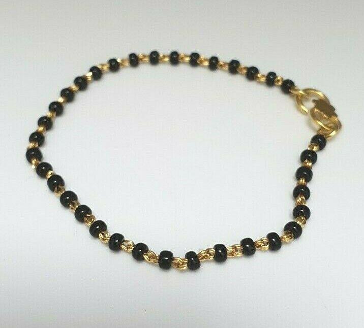 18ct Yellow Gold Baby Bracelet Black Beaded With Diamond Cut Design