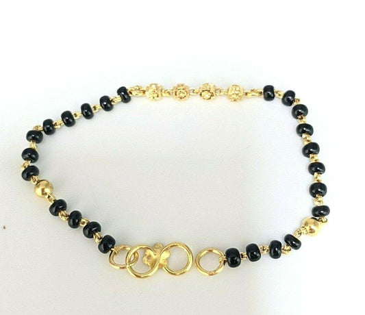 22ct Yellow Gold Baby Bracelet Black-Beads With Diamond Cut Design